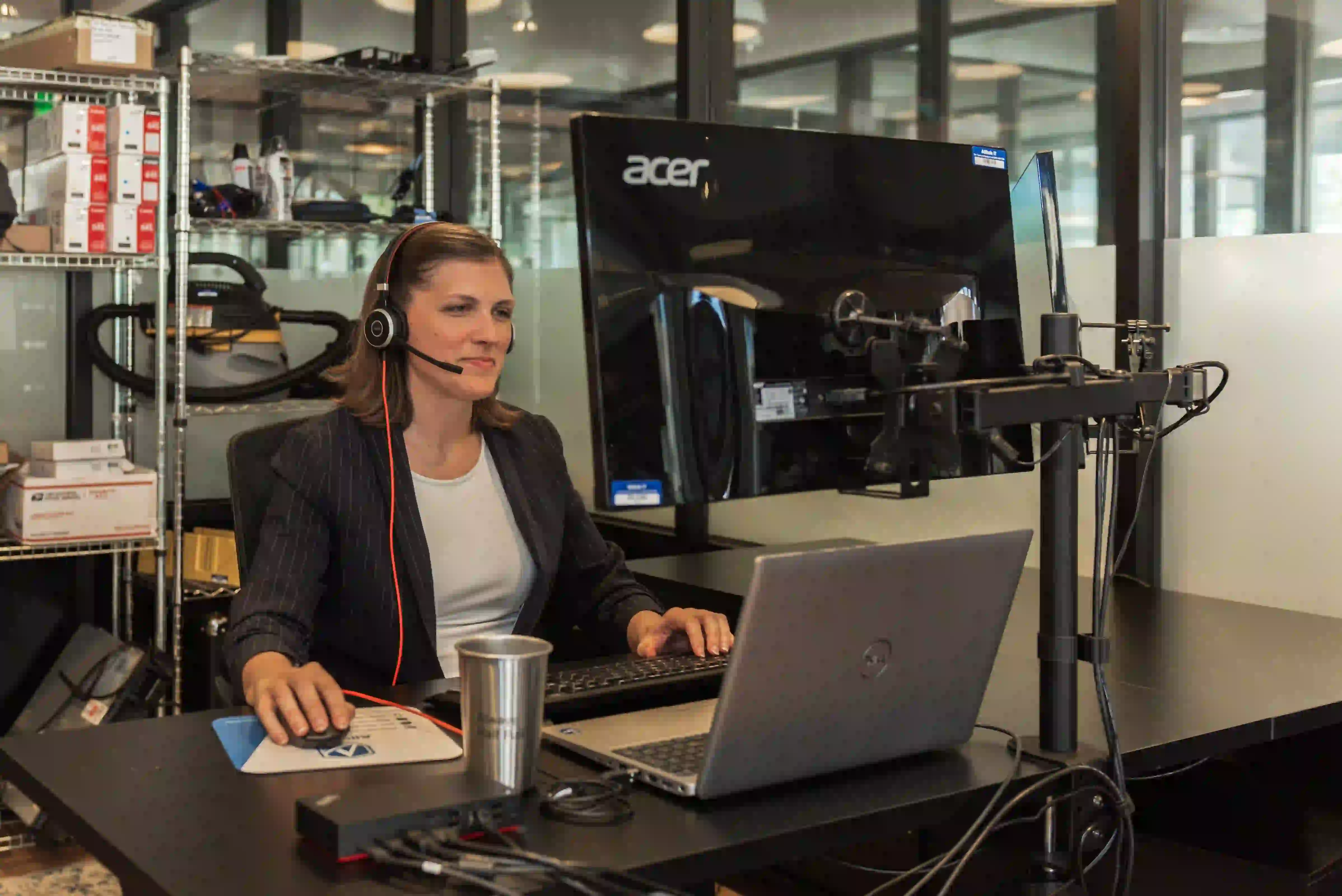 IT specialist configuring VoIP phone system for office communication